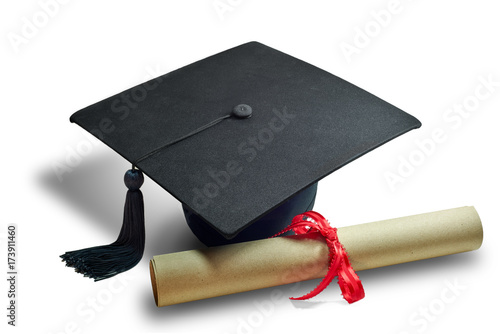 Black graduate cap with diploma brown paper on isolated white background.