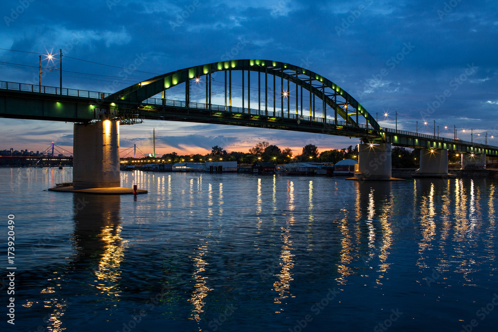 Panorama Night View Of A Bridge Over River Sava A Right Tributary Of The Danube In Belgrade Capital City Of Serbia Panorama Night View Of A Bridge Over River Sava A Right Tributary Of The Danube In Belgrade Capital City Of Serbia