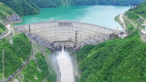 Takeoff Flying over Dam in Mountain Landscape Aerial 4k video. Green Alternative renewable Energy Electric Power technology scene.