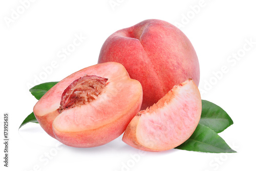 whole and half with slice of peach with green leaves isolated on the white background
