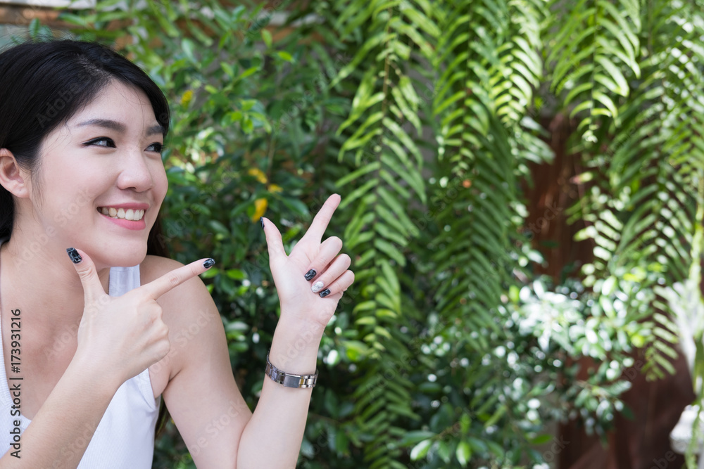 asian woman sit at outdoor cafe. young female adult with natural make-up relax at coffee shop. attractive teenager smile with happiness in garden asian woman sit at outdoor cafe. young female adult with natural make-up relax at coffee shop. attractive teenager smile with happiness in garden