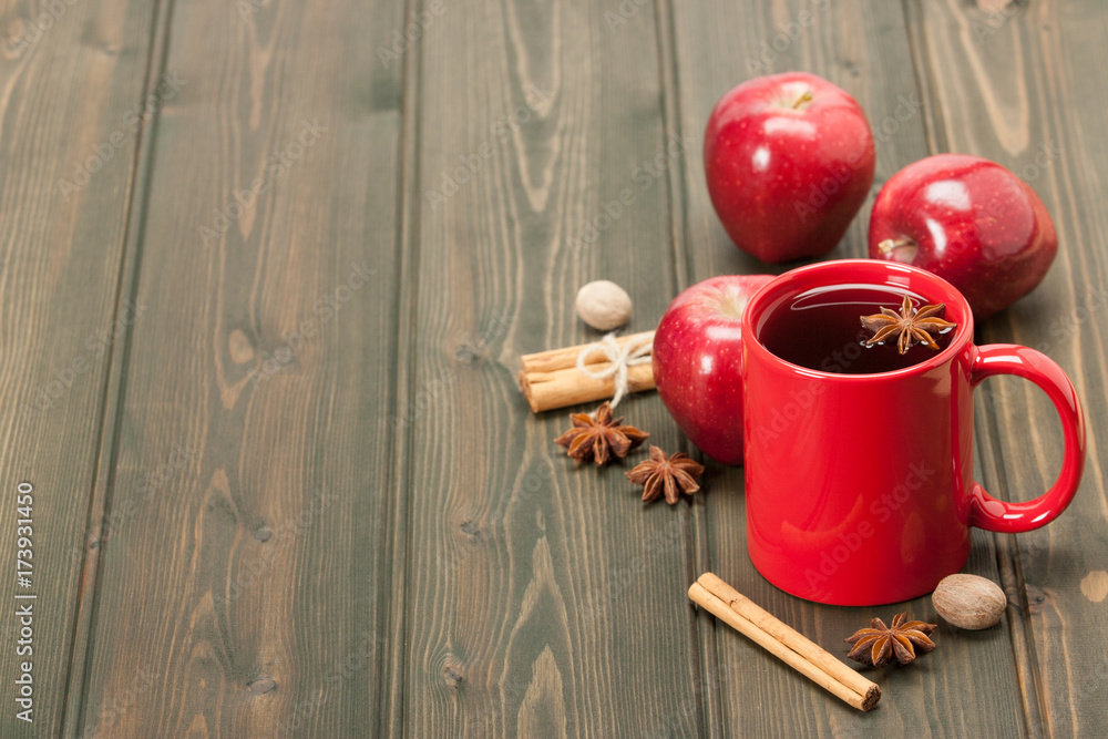 Mug Of Tea Or Coffee. Apples, Spices. Wooden Background With Copy Space