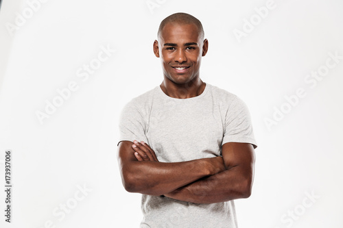 Young african man standing isolated