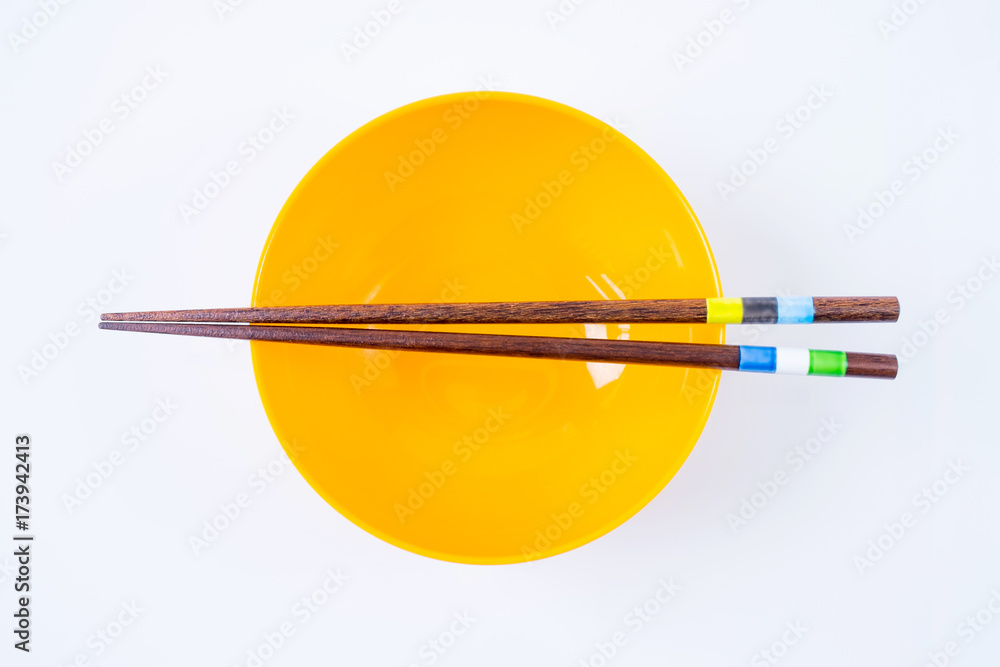 Chopstick and Orange Bowl isolated on white Background Chopstick and Orange Bowl isolated on white Background