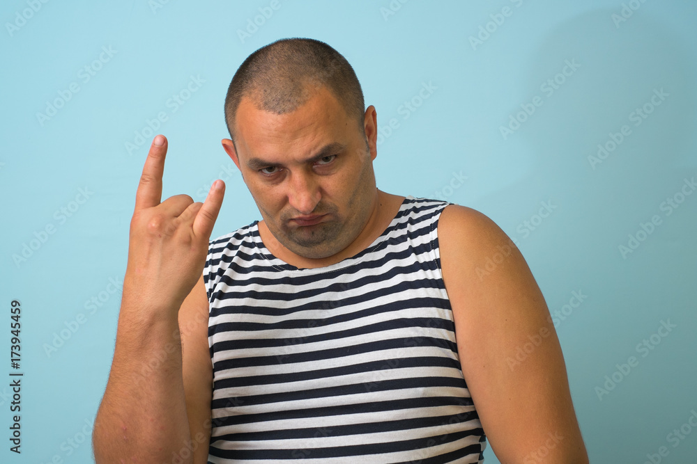 Naklejka premium Man shows rocker