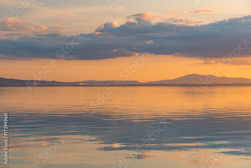 sunset over Lake Trasimeno in Umbria  with rippled water