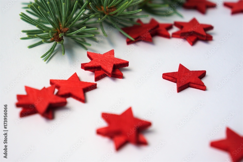 Christmas theme with red wooden stars on white background