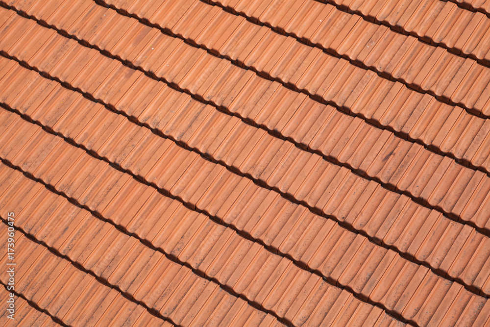 Traditional red roof tiling, background photo Traditional red roof tiling, background photo