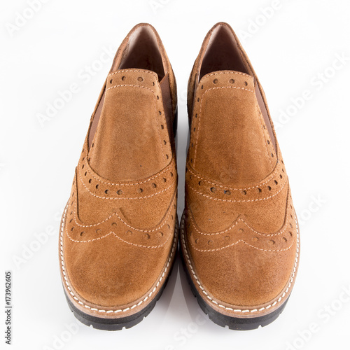 Female brown leather shoe on white background, isolated product.