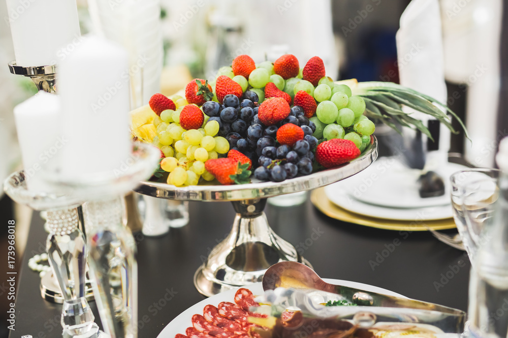 Delicious sweets on wedding candy buffet with desserts, cupcakes Delicious sweets on wedding candy buffet with desserts, cupcakes