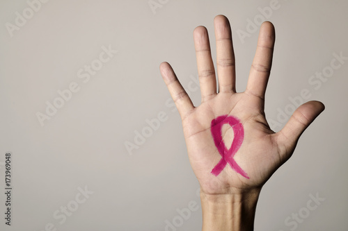Fototapeta man with a pink ribbon for the breast cancer