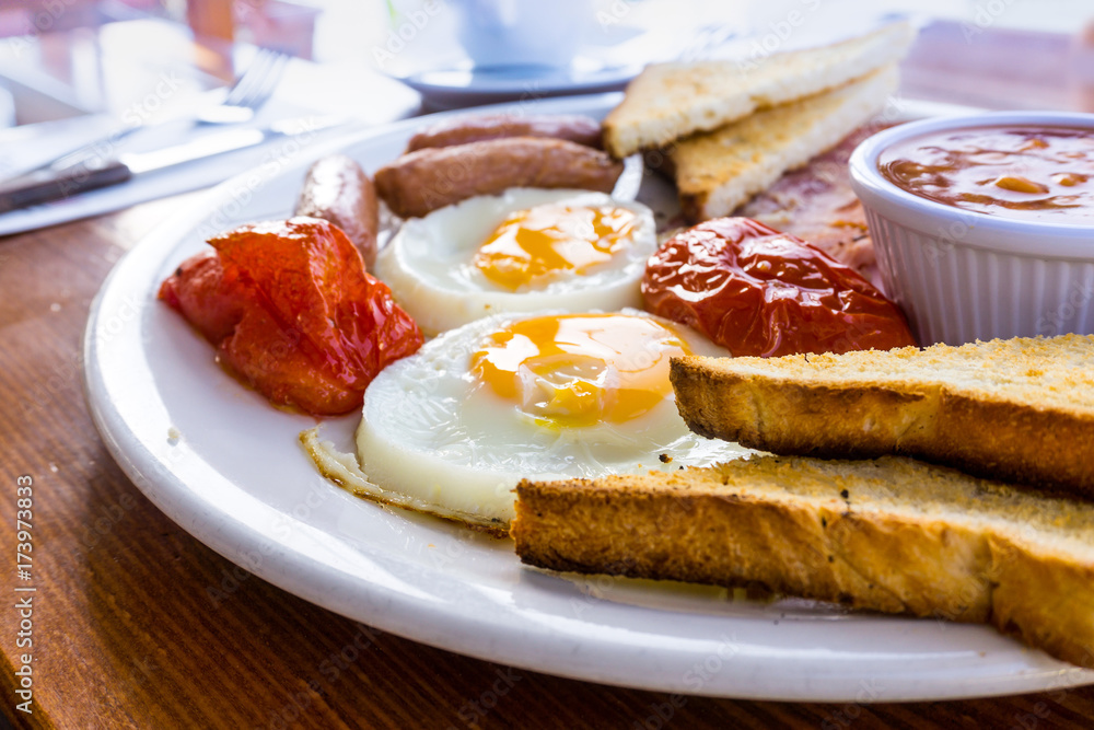 Breakfast with ham and fresh egg on table Breakfast with ham and fresh egg on table