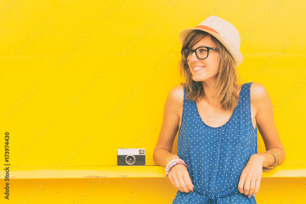 Hipster cute woman posing outdoors with old film camera. Hipster cute woman posing outdoors with old film camera.