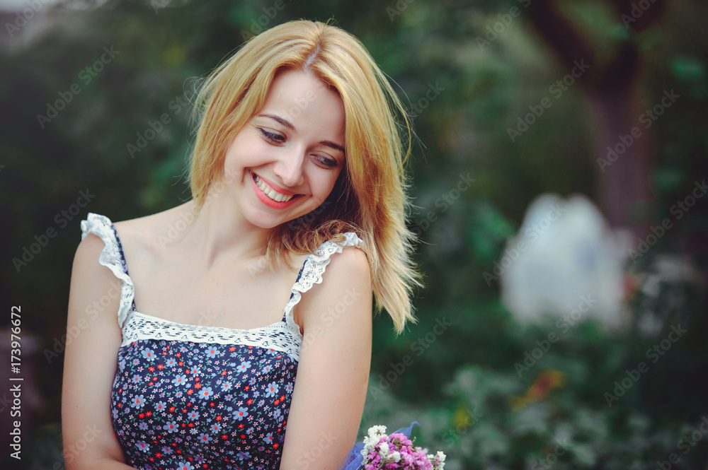 Naklejka premium portrait of a happy woman on a picnic with and smiling, union with nature and a healthy lifestyle