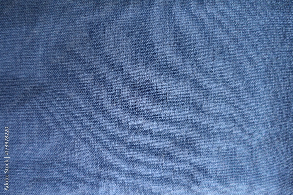 Simple blue linen fabric surface from above Simple blue linen fabric surface from above