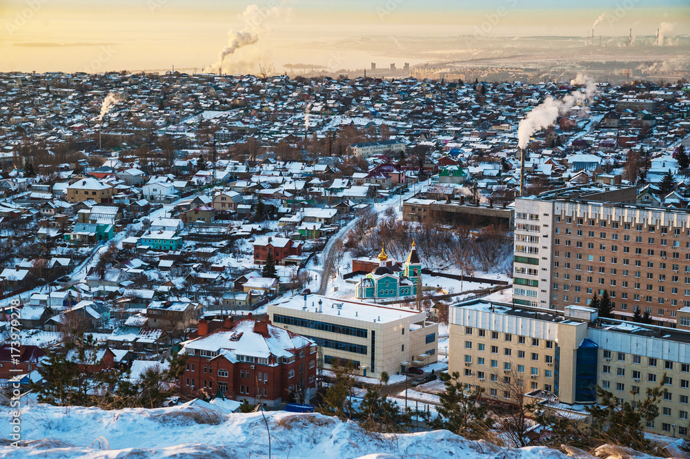 Beautiful winter landscape. Morning sunrise, evening sunset. Nature of Saratov, Russia in winter.  View of the city from the mountain.