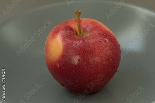 Red apple on table