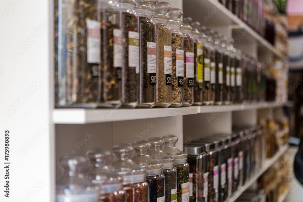 many glass jars with tea