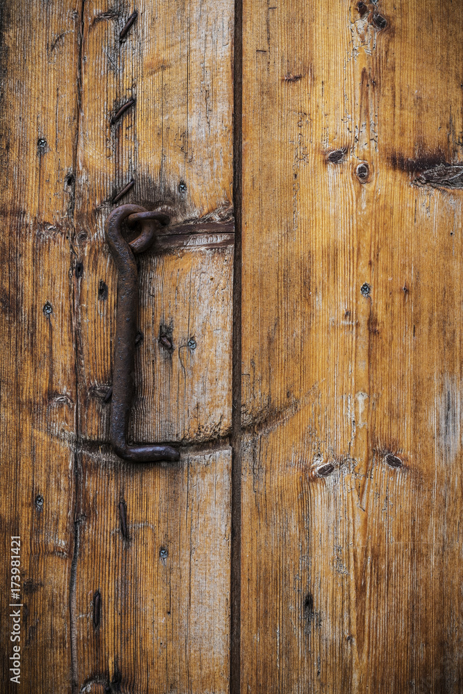 the old wooden door with rusty strength the old wooden door with rusty strength