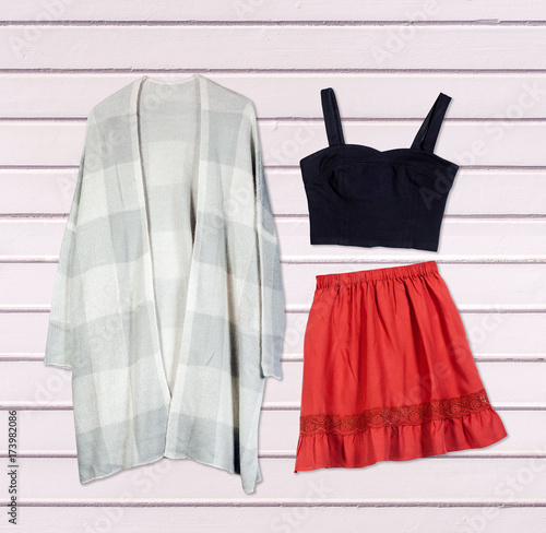 Overhead of clothes and woman accessories. Outfit of casual and modern woman on isolated white background.