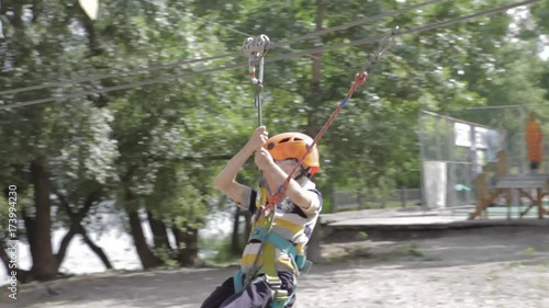 Wallpaper Mural Little cute boy enjoying activity in a climbing adventure park on a summer sunny day. toddler climbing in a rope playground structure. Safe Climbing extreme sport with helmet and Carabiner. insurance Torontodigital.ca
