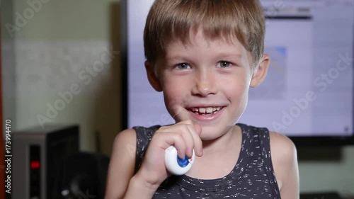 Wallpaper Mural The boy pulls out a tooth with a thread. A child pulls a tooth. The boy himself pulls the milk tooth. Boy loses a tooth and enjoys change. Torontodigital.ca
