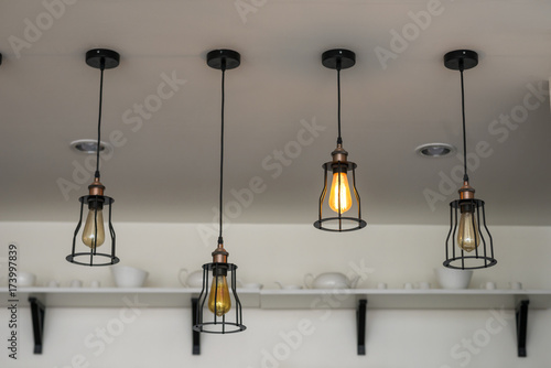 Soft focus ceiling lighting, warm lighting in cafes and restaurants interior.
