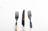 Forks and knife design on white background. Copy space.