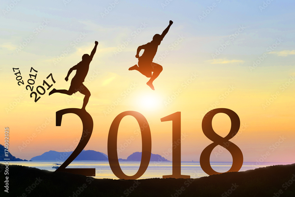 Men jump over silhouette Happy New Year 2018 Men jump over silhouette Happy New Year 2018