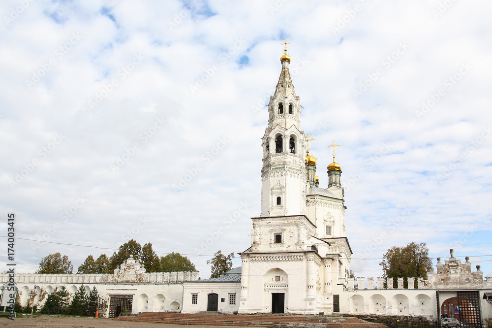 White high church with golden domes in the ancient Russian town of Verkhoturye
