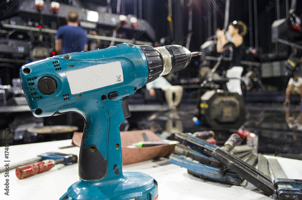 Charged drills and tools are waiting to work on the table Charged drills and tools are waiting to work on the table