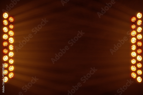 Bright stage lights flashing in orange color place for your text copy space photo