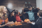 Parents entertain children at a Halloween party