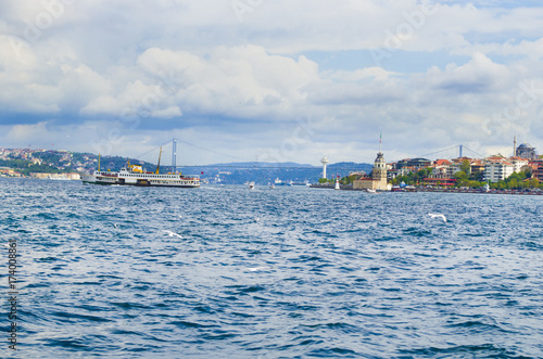 Ferries over the Istanbul Strait, the maiden's tower and the 15th July Martyr's Bridge at the back