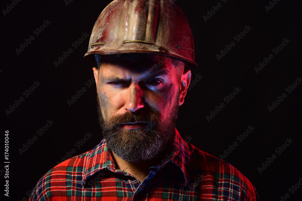 Builder or miner with thick beard. Man with concerned face Builder or miner with thick beard. Man with concerned face