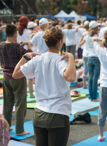 people doing yoga exercises outdoors