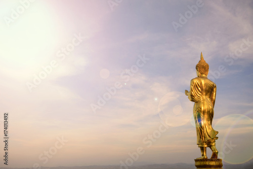 Wat Phra That Khao Noi,View point,Golden Buddha statue standing on a mountainand lens fare,Nan, Thailand,