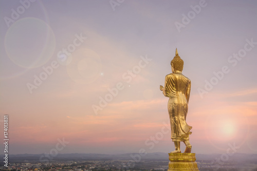 Wat Phra That Khao Noi,View point,Golden Buddha statue standing on a mountainand lens fare,Nan, Thailand, photo