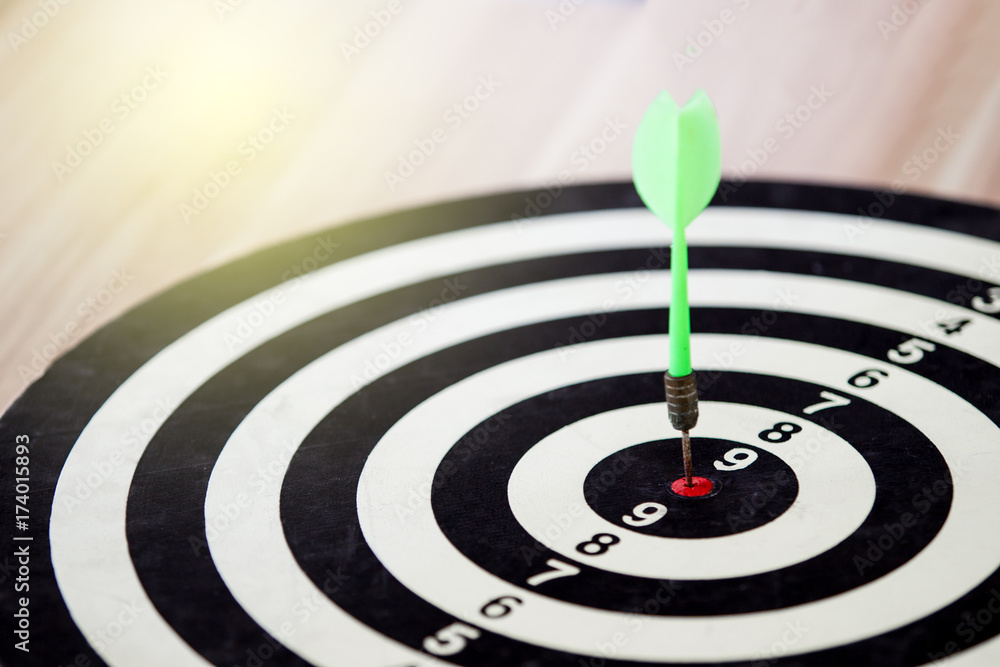Classic bull eye target hitted by arrow into the center of bull eye target close up. Classic bull eye target hitted by arrow into the center of bull eye target close up.