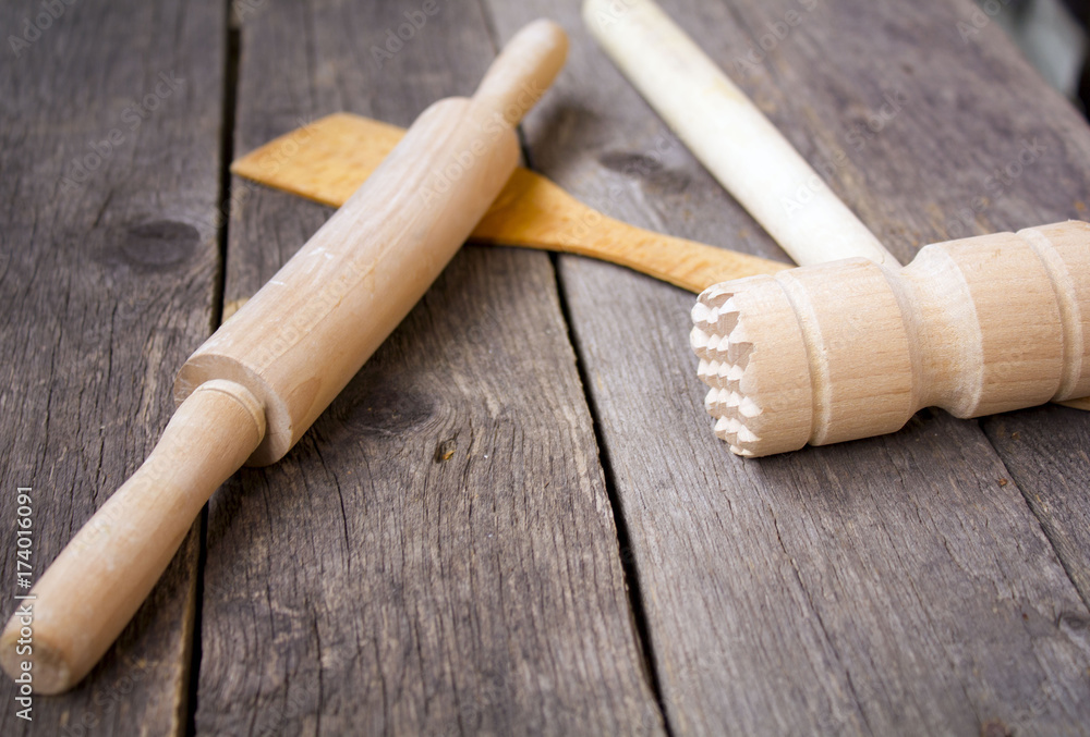 wooden rolling pin and a hammer