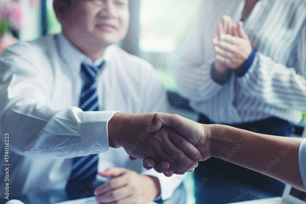 Business people shaking hands, finishing up a meeting Handshake Business concept