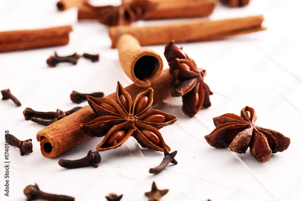 cinnamon, staranise and cloves. winter spices on white background cinnamon, staranise and cloves. winter spices on white background