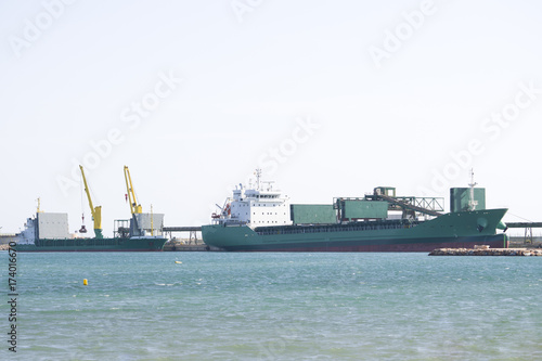 Two boats in port waiting for cargo
