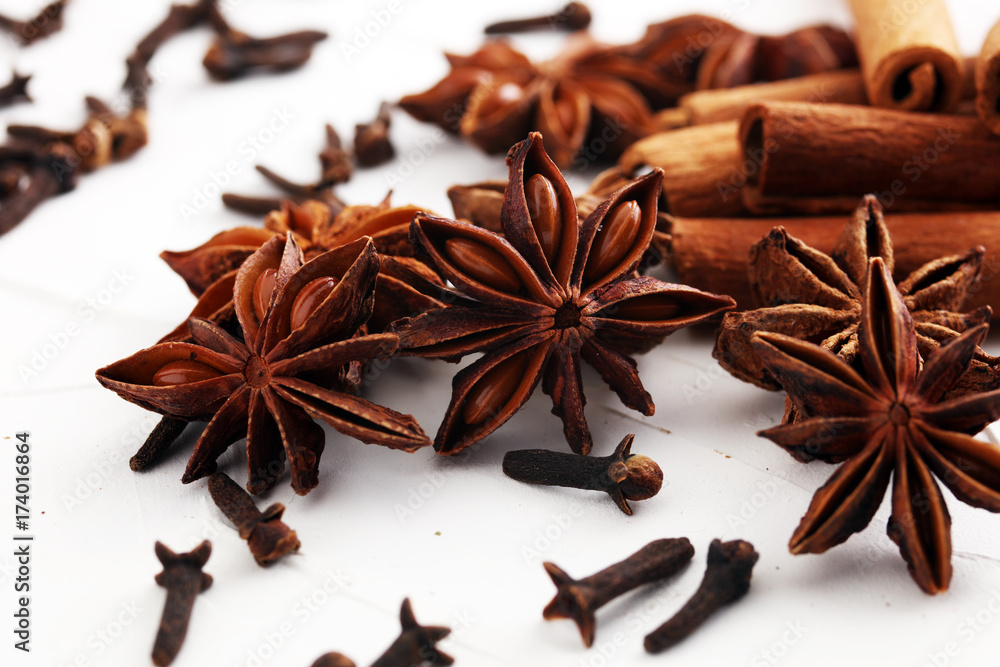 cinnamon, staranise and cloves. winter spices on white background cinnamon, staranise and cloves. winter spices on white background