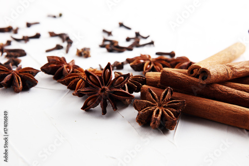 cinnamon, staranise and cloves. winter spices on white background