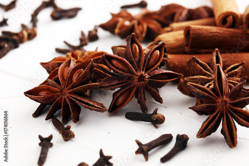 cinnamon, staranise and cloves. winter spices on white background