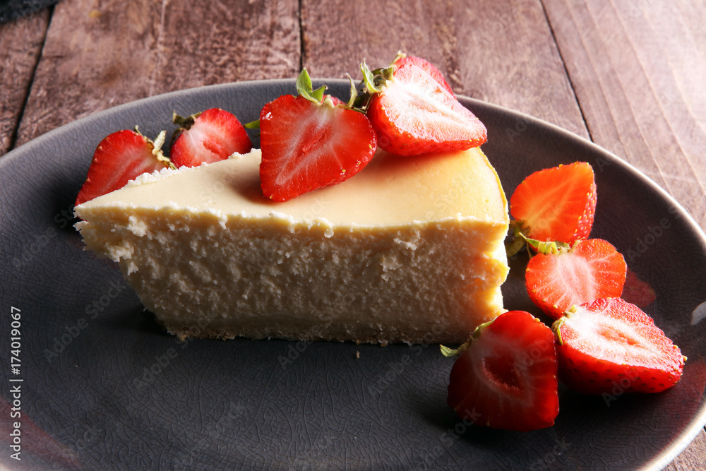Homemade cheesecake with fresh strawberries and mint for dessert - healthy organic summer dessert pie cheesecake. Vanilla Cheese Cake. Homemade cheesecake with fresh strawberries and mint for dessert - healthy organic summer dessert pie cheesecake. Vanilla Cheese Cake.