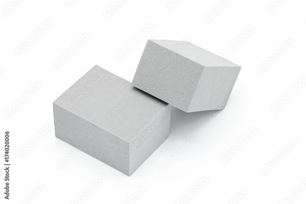cube of grey foam plastic cube of grey foam plastic