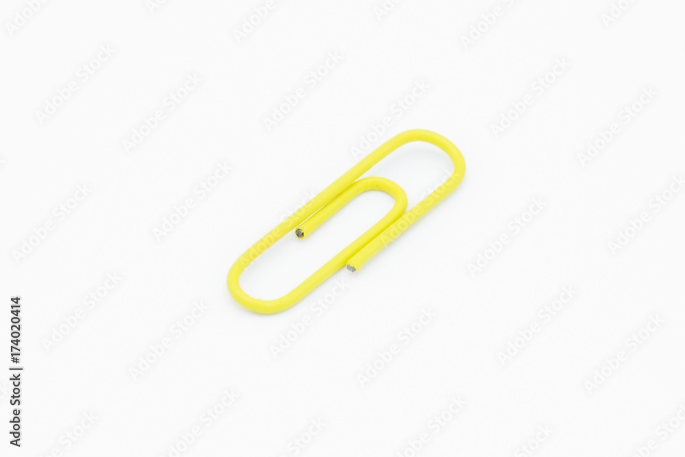 yellow paper clip isolated on white background yellow paper clip isolated on white background