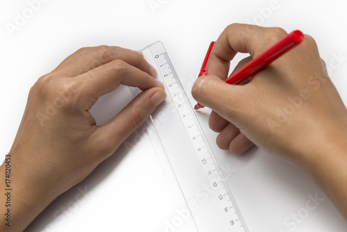 Hands Drawing A Line Using Ruler, Isolated On White Background